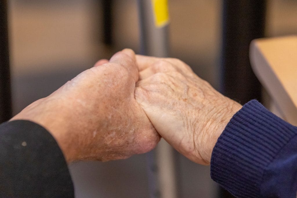 2 people holding hands