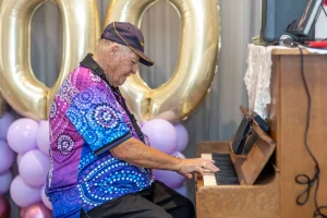 Older man playing piano