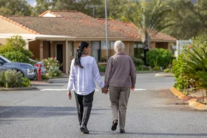 Two ladies holding hands