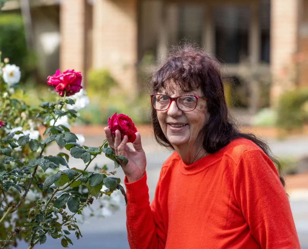 Woman holding red rose
